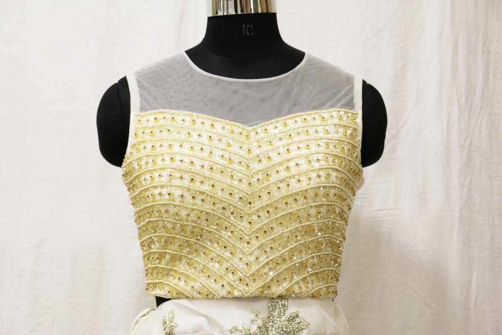 Cream lehenga choli with embroidery and sippy work